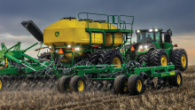 New John Deere Tractor and Planter in the field