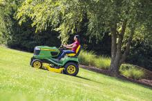 John Deere X700 Series Tractor Mowing a Hill