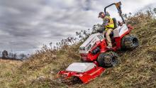 Ventrac tractor mowing on steep slope