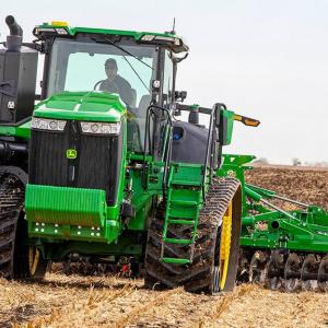 Image of a 9RT 490 Tractor tilling a field