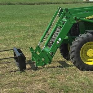 field image of ab14 bale spear on tractor in field